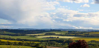 Storm clouds behind sunny sutton scarsdale farm.jpg